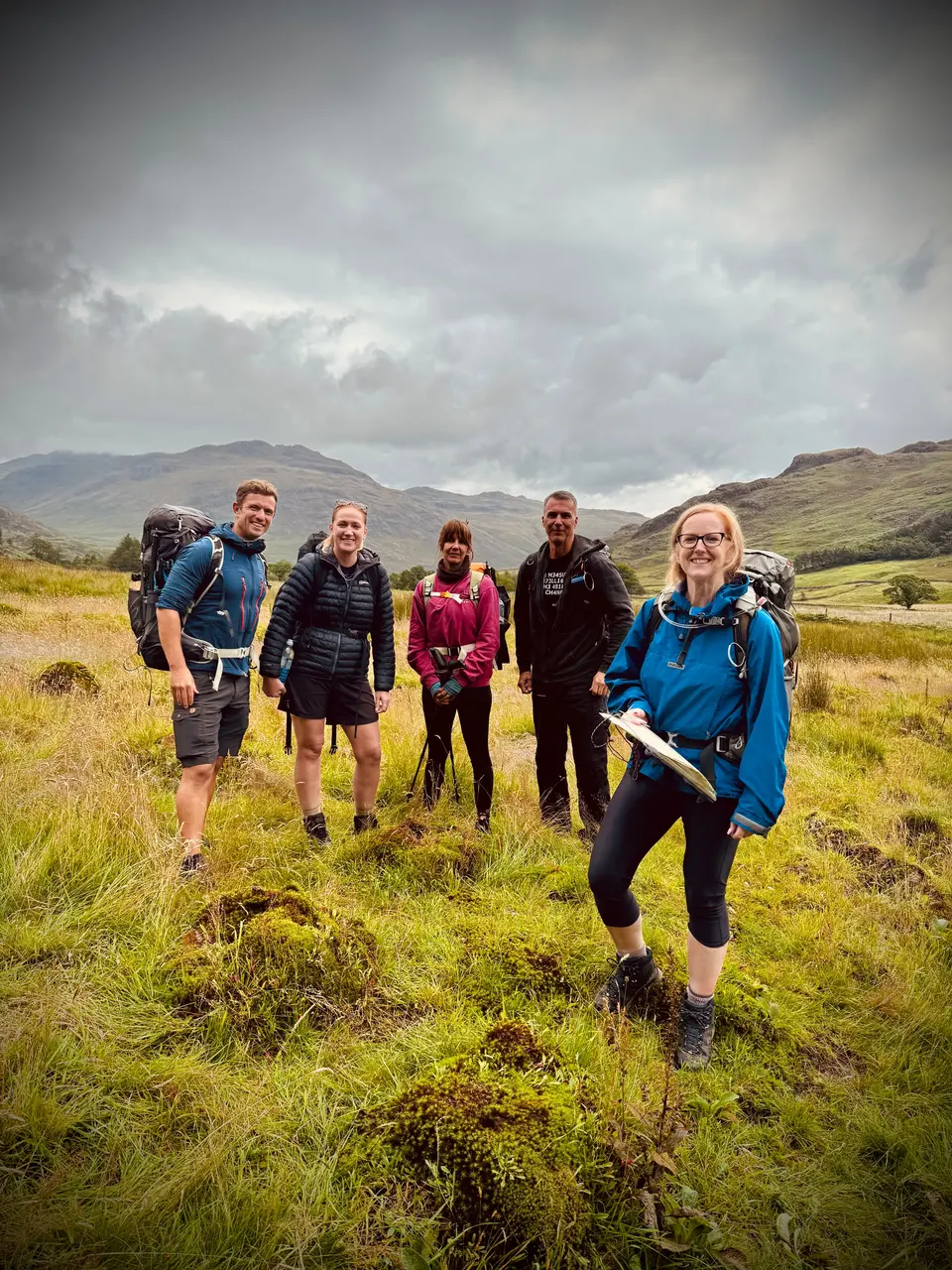 A group of walkers on a hill path
