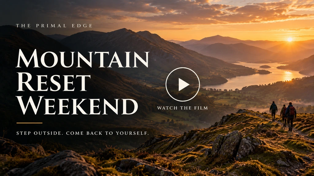 Mountain Reset Weekend — watch the film. Golden dawn over a mountain lake with walkers on the ridge.