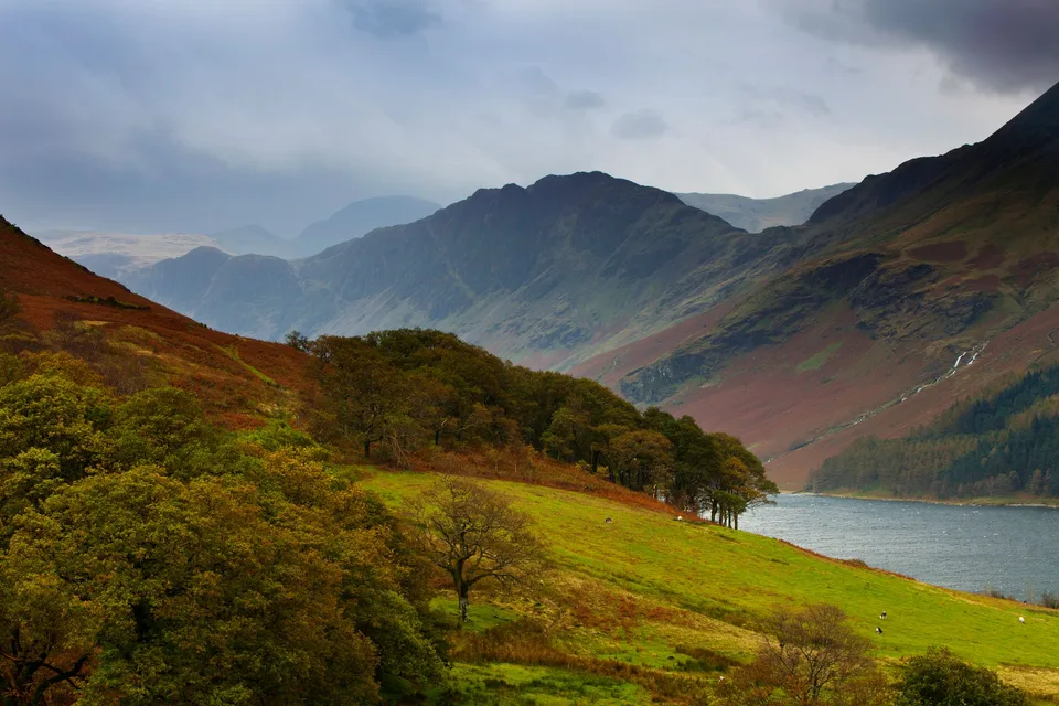 Exposed Lake District ridges above an autumn valley and lake